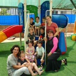 W&J Senior Hailey Nudelman stands in a playground with her students in Israel.