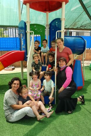 W&J Senior Hailey Nudelman stands in a playground with her students in Israel.