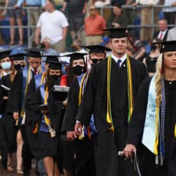 Students walking into the graduation ceremony.