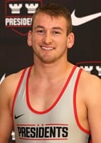 W&J Senior Jaden Datz smiles in his wrestling uniform.