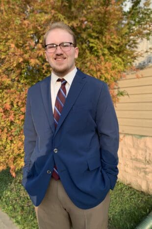 W&J Senior Jeffrey E Seabury Jr. stands and smiles.