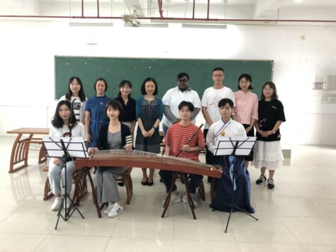 Photo of Han Ye, Ph.D., assistant professor of Chinese at W&J, in a classroom with her students.