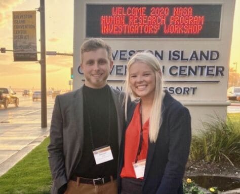 Brach Herzig and Julia Schaffer pose outside the NASA Workshop where they presented their research.