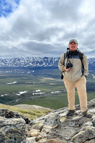 Recent W&J alumnus Jeffrey Seabury, Jr. '22 stands atop a mountain in Alaska during his Magellan Project.