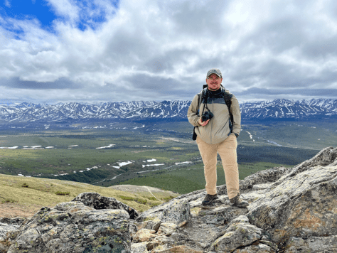 Recent W&J alumnus Jeffrey Seabury, Jr. '22 stands atop a mountain in Alaska during his Magellan Project.