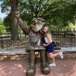 W&J alumna, Ashely Kunkle poses with University of South Carolina mascot statue.