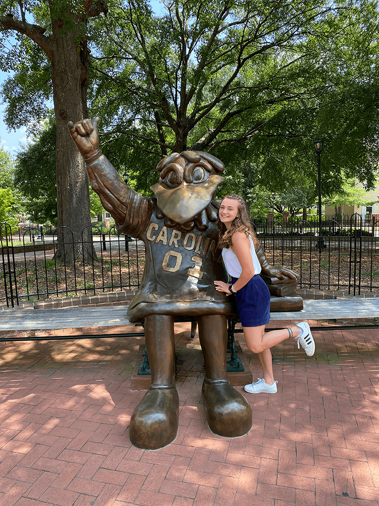 W&J alumna, Ashely Kunkle poses with University of South Carolina mascot statue.