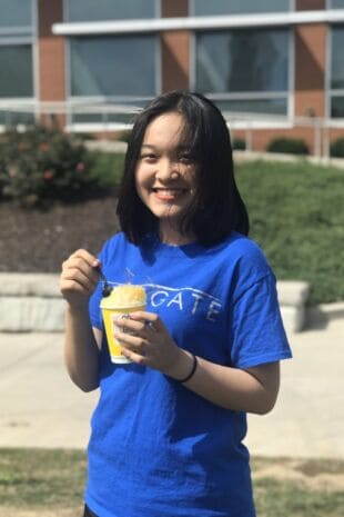 Linh Hoang Tu Khuat eating ice cream at orientation