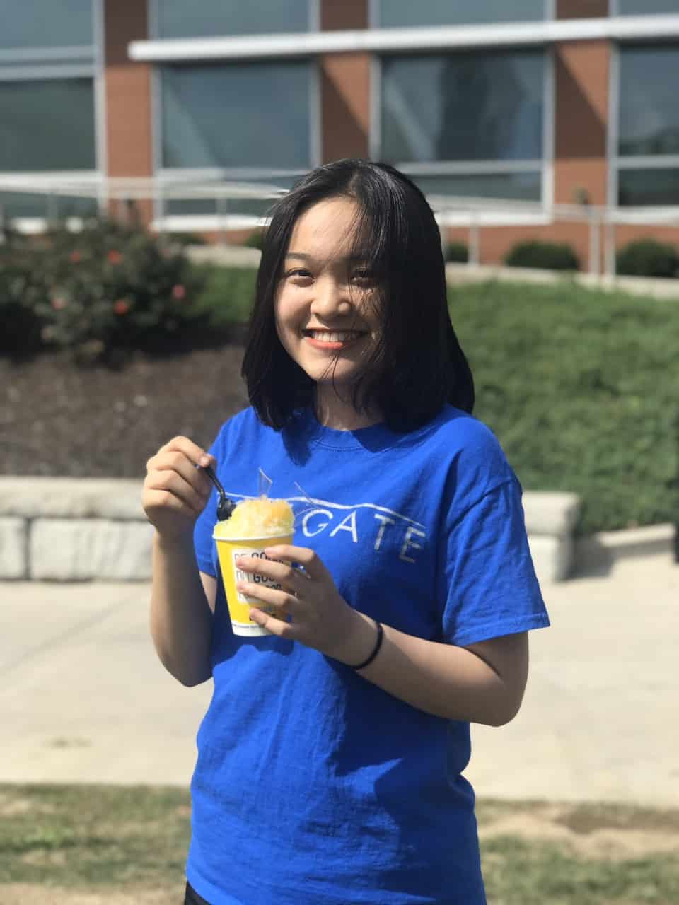 Linh Hoang Tu Khuat eating ice cream at orientation