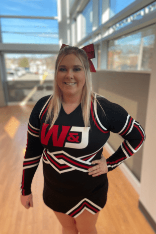 W&J senior Maci Ward poses in her W&J Cheer uniform.