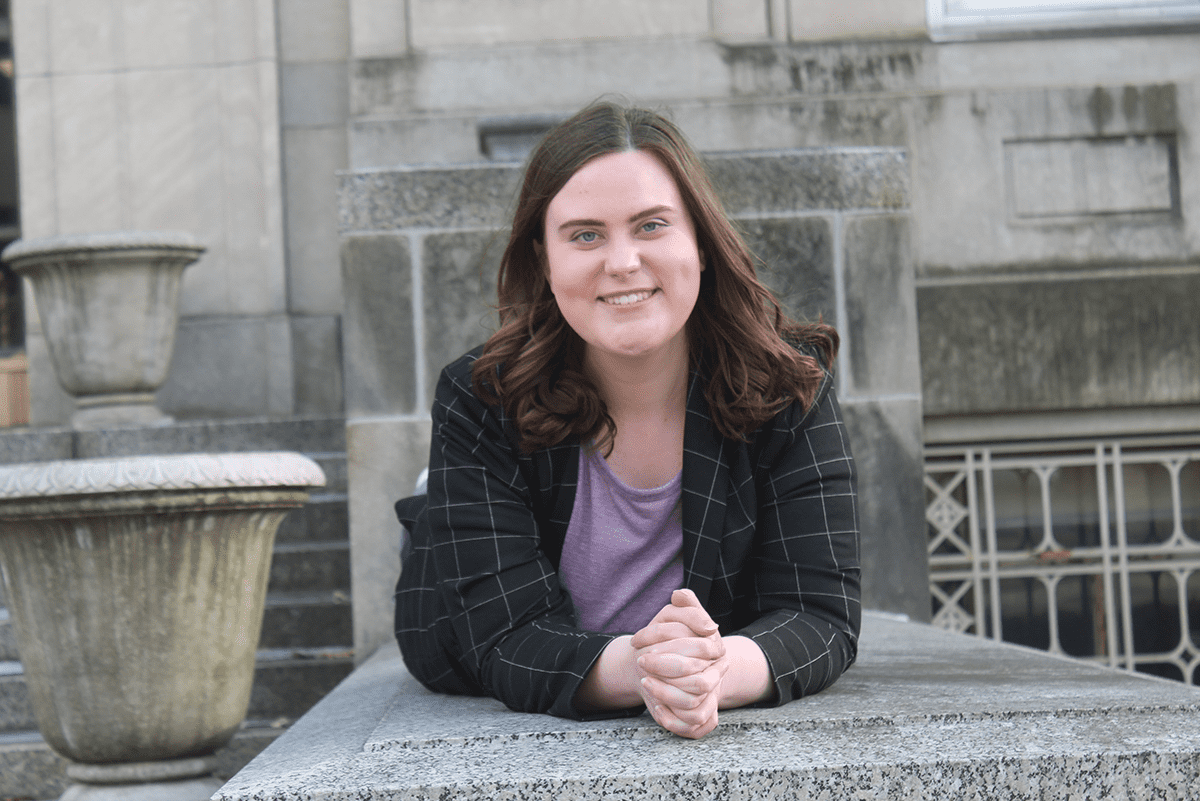 W&J Senior Natalie McBride lays on stomach and smiles.