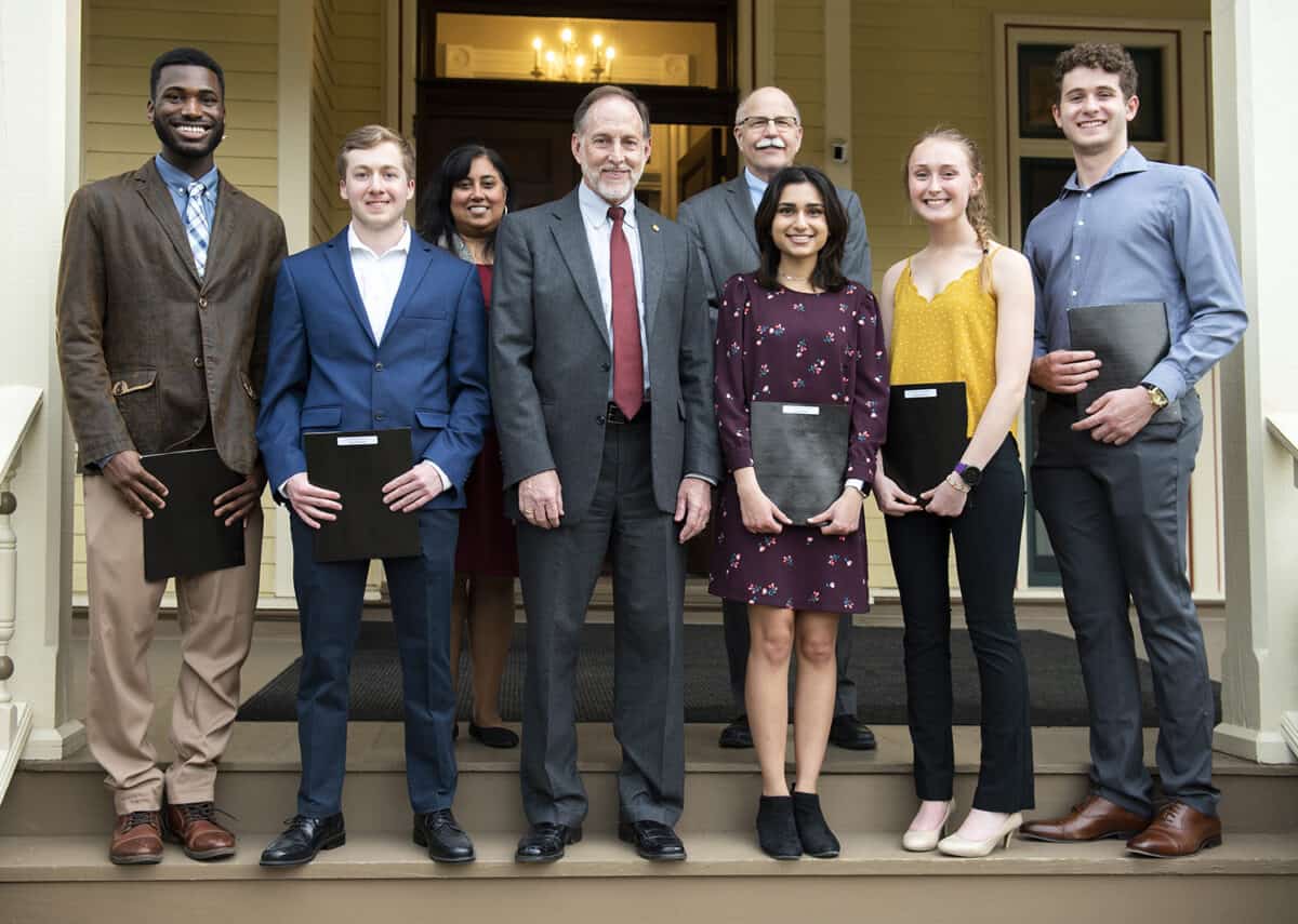 The five winners of the Rule, Hughes, Murphy Award are pictured with members of the College's senior staff on the porch of the President's House.