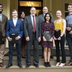 The five winners of the Rule, Hughes, Murphy Award are pictured with members of the College's senior staff on the porch of the President's House.