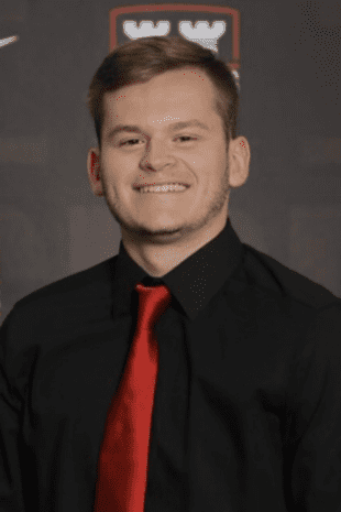 W&J Senior Robert Fleischauer smiles in a black shirt and red tie.