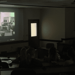 Recent W&J alumna Rosa Messersmith premiers first films with a projector in a classroom.
