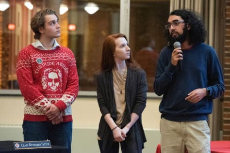 Students in Active Minds make a proposal during an SGA meeting.