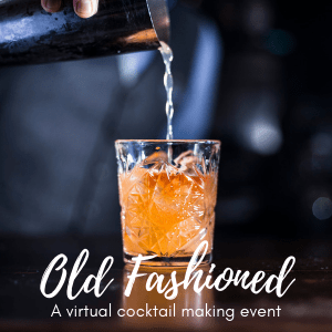 Hand and shaker pouring Old Fashioned cocktail