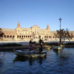 Plaza de España-Sevilla, Spain with people in small row boats in the foreground