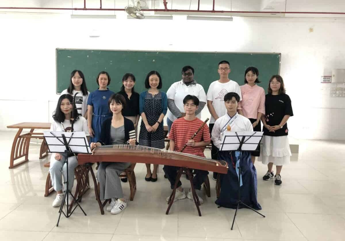 Photo of Han Ye, Ph.D., assistant professor of Chinese at W&J, in a classroom with her students.