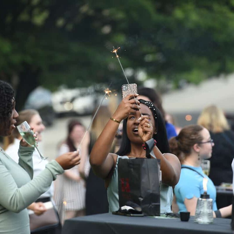 Seniors light sparklers on the Burnett Lawn for their senior wish May 22, 2021 on the campus of Washington &amp; Jefferson College in Washington, Pa.