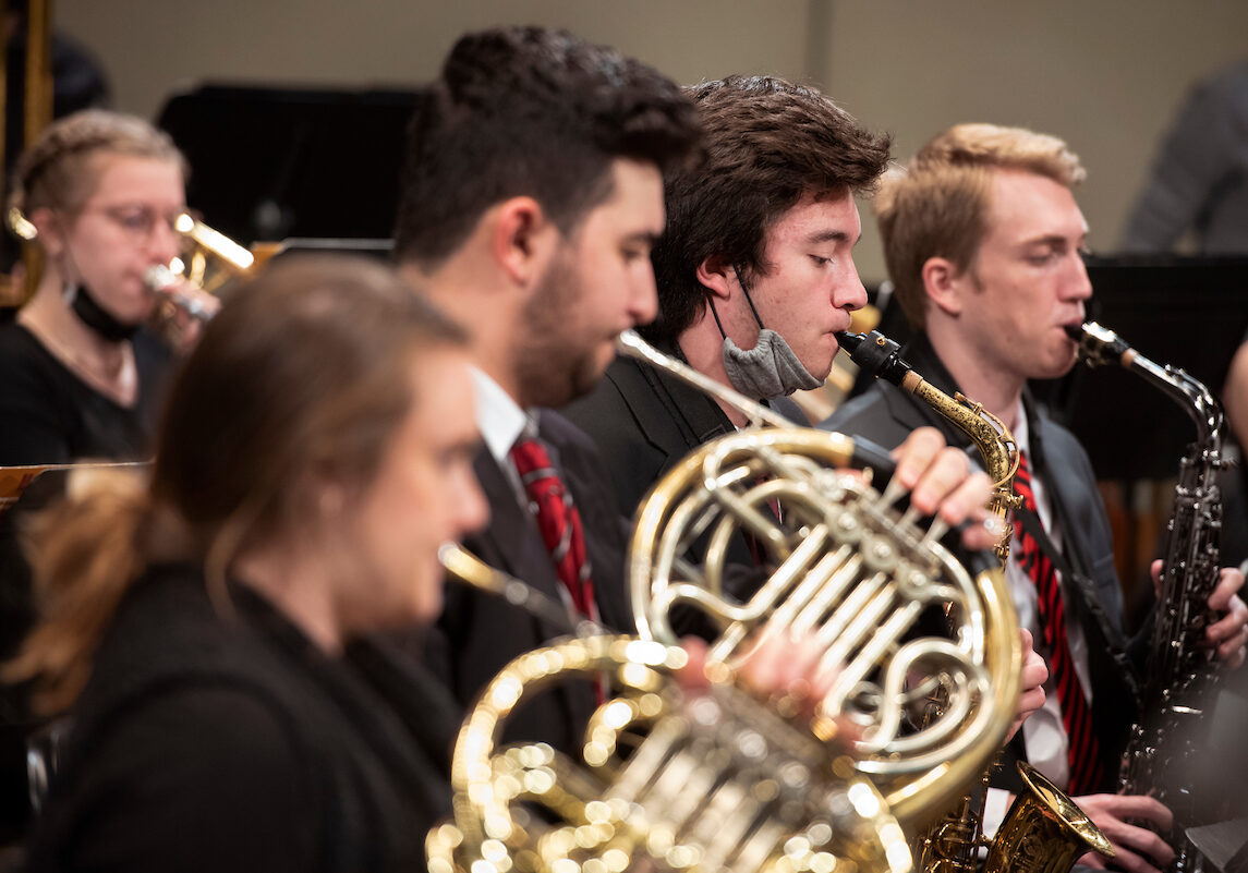 Members of the W&amp;J wind ensemble are led by Clint Bleil during a rehearsal December 6, 2021 before the holiday concert in the Olin Theatre on the campus of Washington &amp; Jefferson College in Washington, Pa.