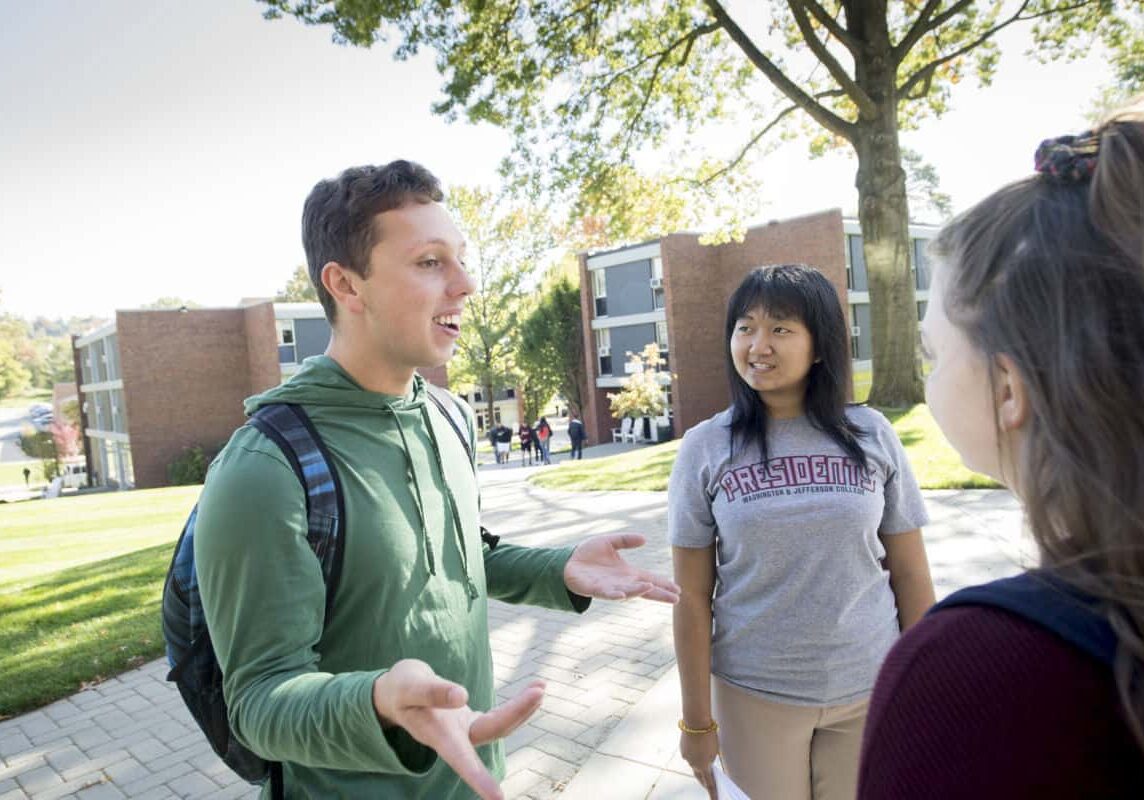 Students walk and talk on the pathway through the Presidents Row residence halls as seen October 21, 2019 during the Creosote Affects photo shoot at Washington &amp; Jefferson College.