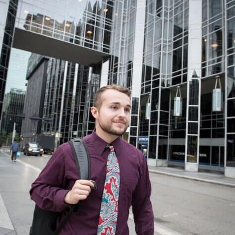 A student walks through PPG Place in the city of Pittsburgh near Market Square October 21, 2019 during the Creosote Affects photo shoot at Washington & Jefferson College.