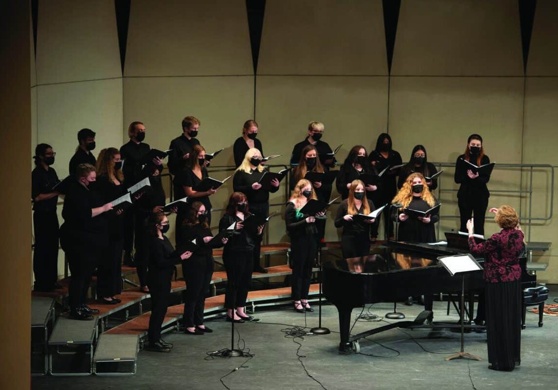 Members of the W&amp;J choir and Camerata Singers are led by Professor of Music Susan A. Medley, DMA, during the holiday concert December 6, 2021 in the Olin Theatre on the campus of Washington &amp; Jefferson College in Washington, Pa.