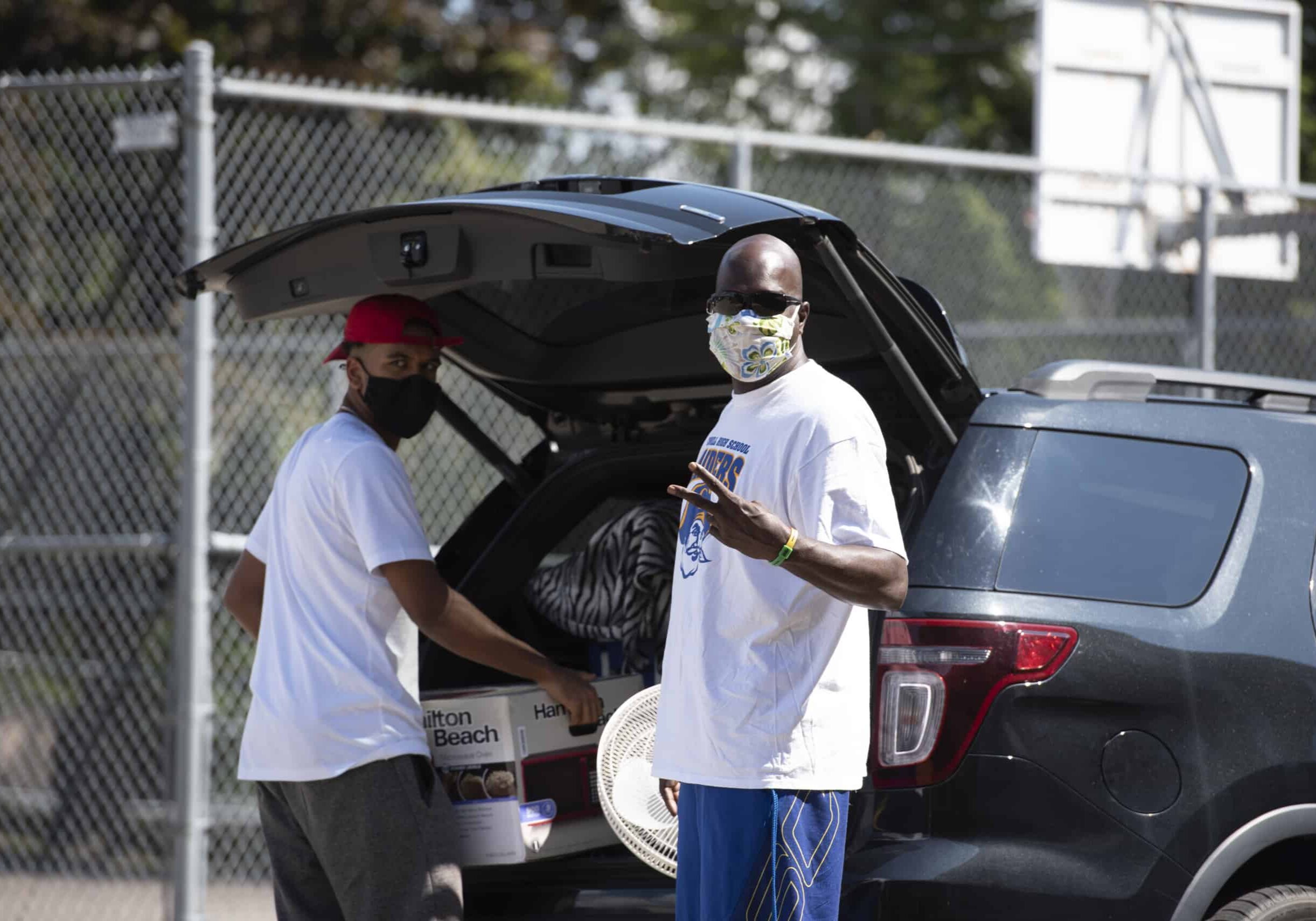 Students and parents unload their cars and carry items in to students residence hall rooms during move in August 22, 2020 on the campus of Washington &amp; Jefferson College.