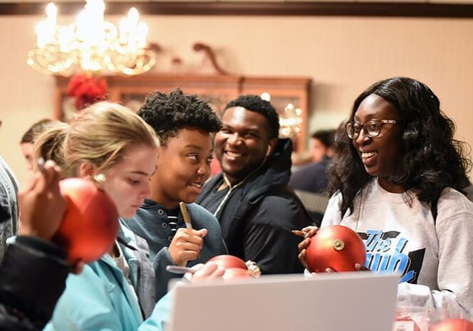 Students gather in the President's Dining Room on W&J's campus to sign ornaments.