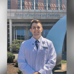 Samuel Florentino standing outside of his medical school