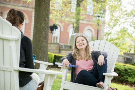 Students in the Adirondack chairs on campus outside of Old Main during the Creosote Affects photo shoot May 1, 2019 at Washington & Jefferson College.