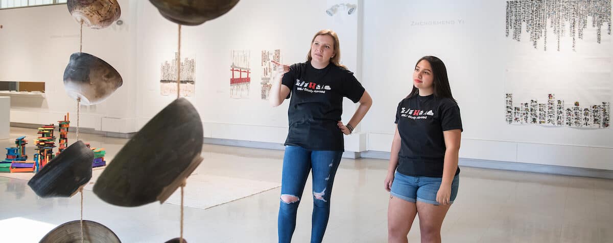Students look at works of art in the Gallery in Olin Fine Arts Center during the Creosote Affects photo shoot May 2, 2019 at Washington &amp; Jefferson College.