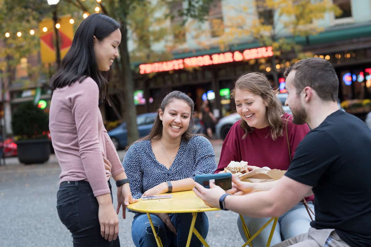 Students hang out in walks in Market Square outside of Primanti Brothers in the city of Pittsburgh October 21, 2019 during the Creosote Affects photo shoot at Washington & Jefferson College.
