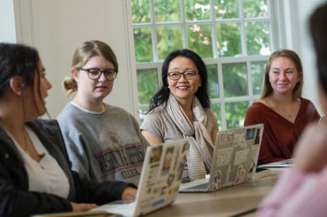 Associate Professor of the English Tara Robbins Fee, Ph.D., works with students.