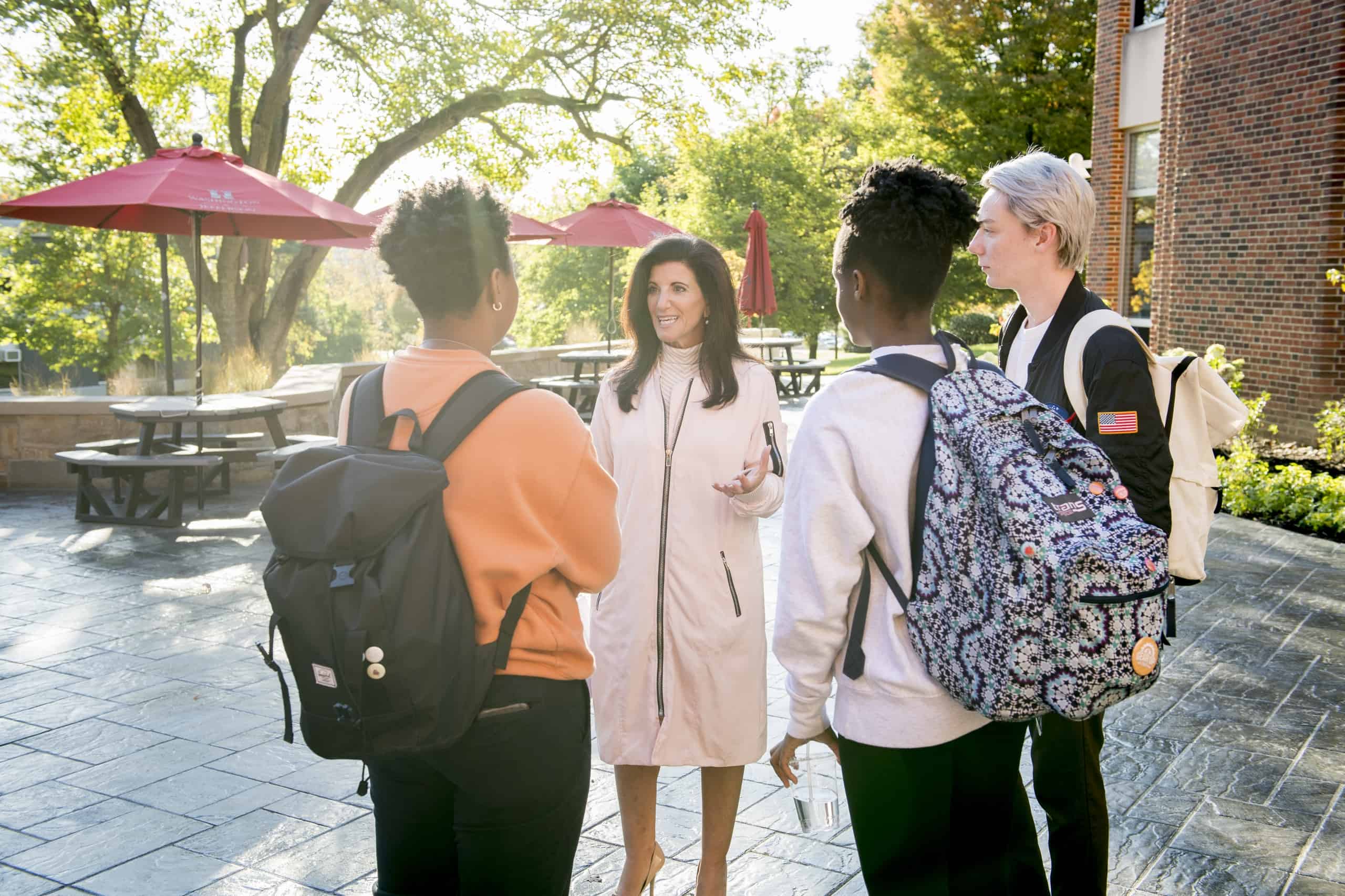 Students talk with faculty member Associate Professor of Economics & Business Lori J. Galley, Ph.D., on the Rossin Campus Center Patio as seen October 21, 2019 during the Creosote Affects photo shoot at Washington & Jefferson College.