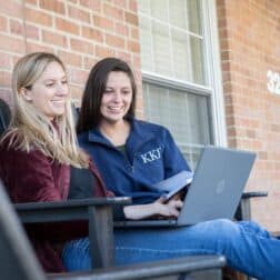 Students sit on a porch on Chestnut Street as seen October 21, 2019 during the Creosote Affects photo shoot at Washington & Jefferson College.