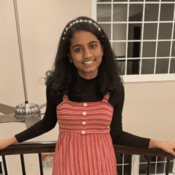 W&J junior Lekhya Kollu poses along a banister and smiles.