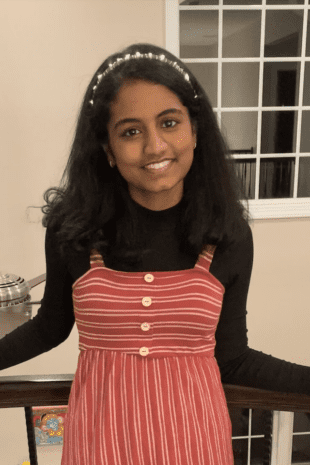 W&J junior Lekhya Kollu poses along a banister and smiles.