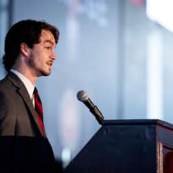 Cole Leathers, president of W&J's Student Government Association, stands at a podium.