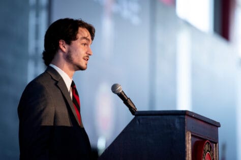 Cole Leathers, president of W&J's Student Government Association, stands at a podium.