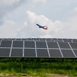 Southwest Airlines plane flying over a solar grid