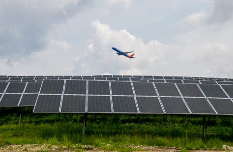 Southwest Airlines plane flying over a solar grid