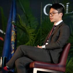 Nathan Law sits on stage at the 2020 Washington & Jefferson College Symposium on Democracy.