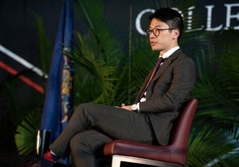 Nathan Law sits on stage at the 2020 Washington & Jefferson College Symposium on Democracy.