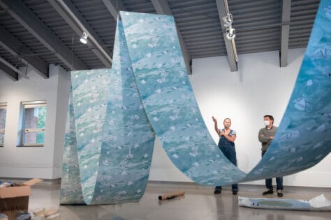 Melissa Haviland talks with Douglas McGlumphy, M.F.A., Olin Art Gallery Director, as she sets up her exhibit in the Olin Fine Art Gallery October 27, 2021 on the campus of Washington & Jefferson College in Washington, Pa.