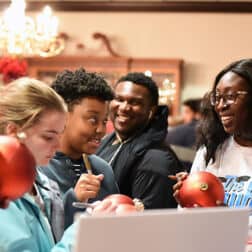 Students gather in the President's Dining Room on W&J's campus to sign ornaments.