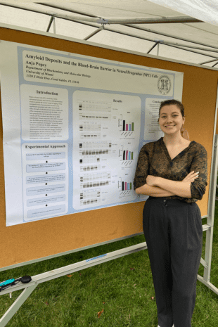 W&J senior Anja Popey poses next to a poster displaying her research.