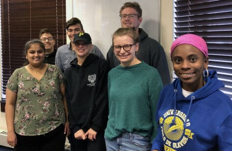 Students in Spanish 457.01 pose together in their classroom in Burnett 102.